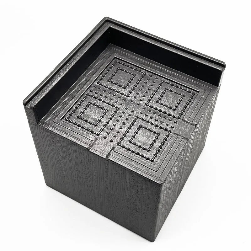 Four black thickened plastic floor mats for furniture leg levelling
