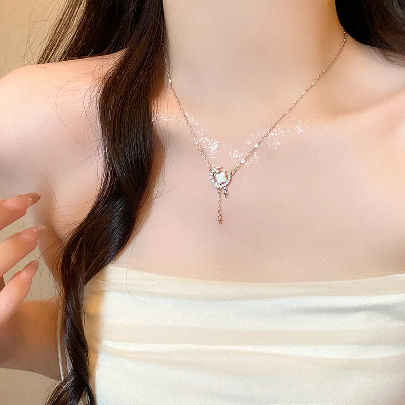 Women's star-shaped necklace with moon decoration on adjustable copper chain in gold finish