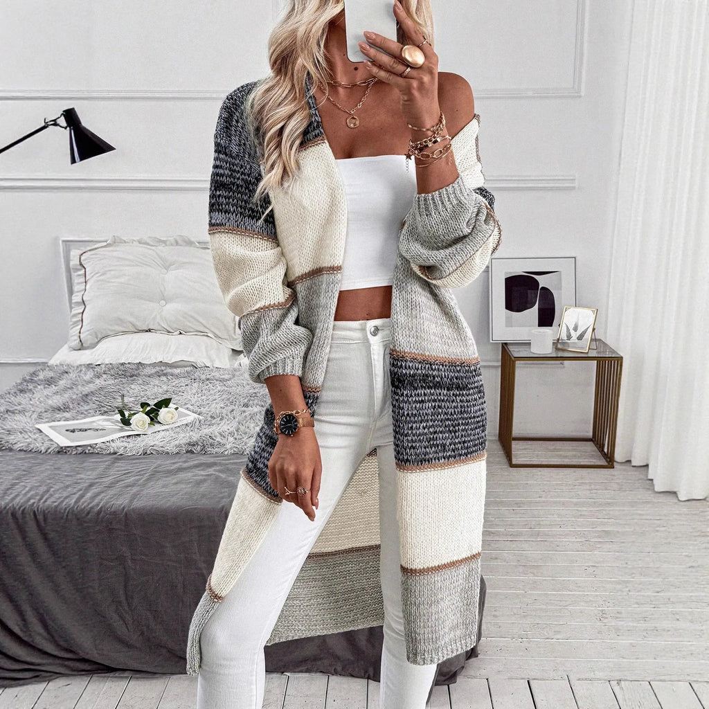 Women's grey striped knitted cardigan with long sleeves and loose fit design