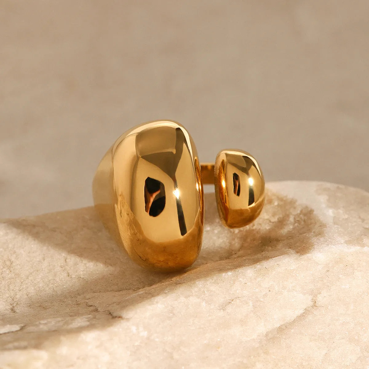 Exaggerated geometric stainless steel open ring for women with electroplated finish.