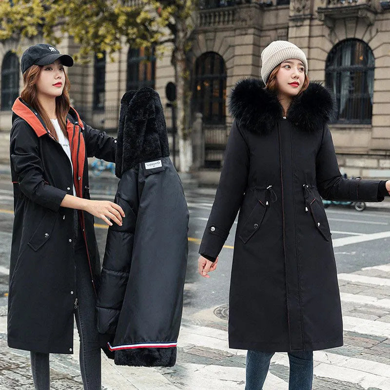 Women's long beige trench coat with a two-way zip front and fleece lining.