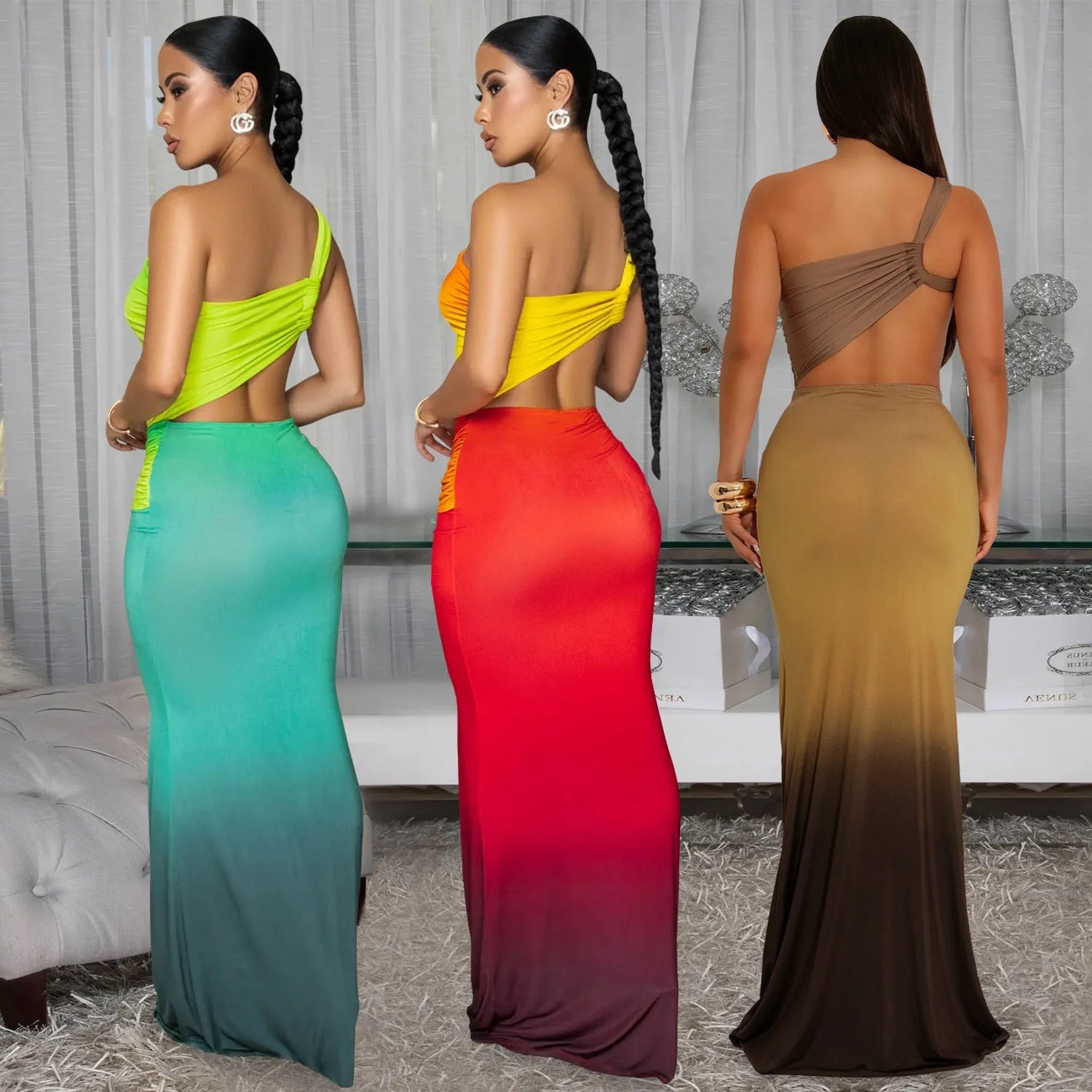 A woman's gradient colour cross-shoulder sleeveless dress with a high waist and long skirt.