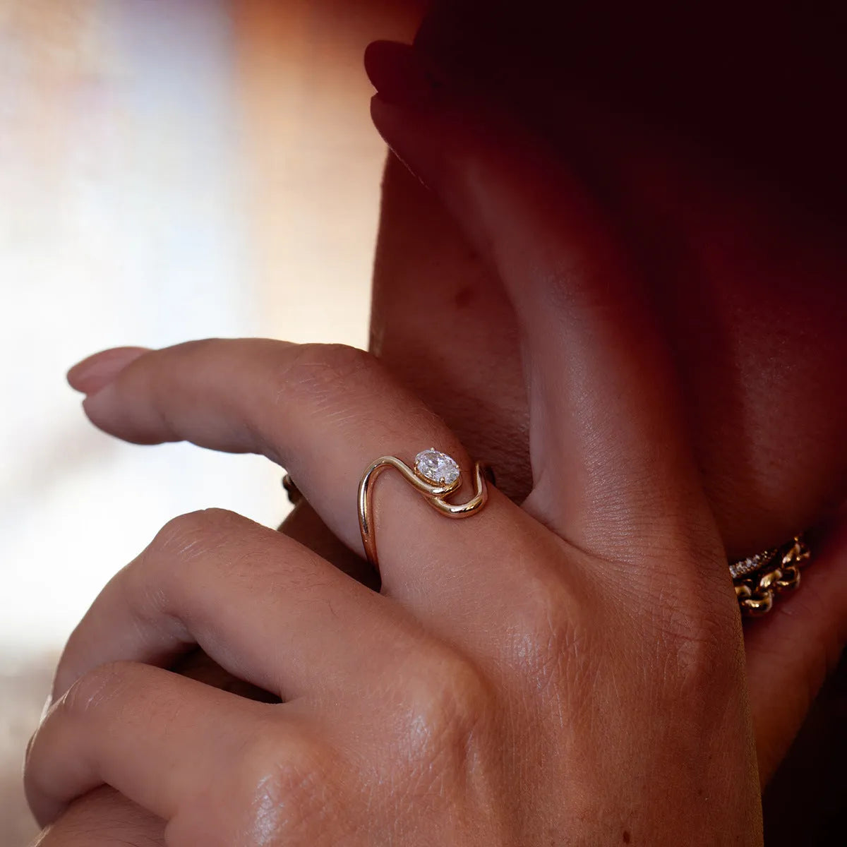 Geometric stainless steel ring with zircon stones in a silver-toned finish.