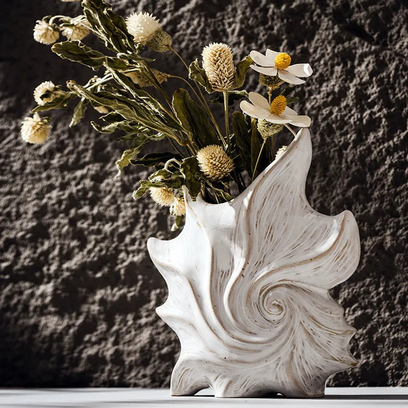 European retro style ceramic vase with a coloured glaze finish on a wooden surface.