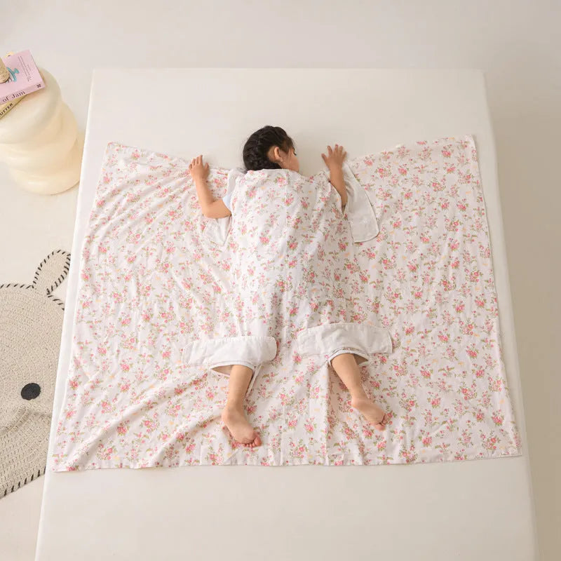 Light blue anti-kick summer blanket with antibacterial filler on a bed
