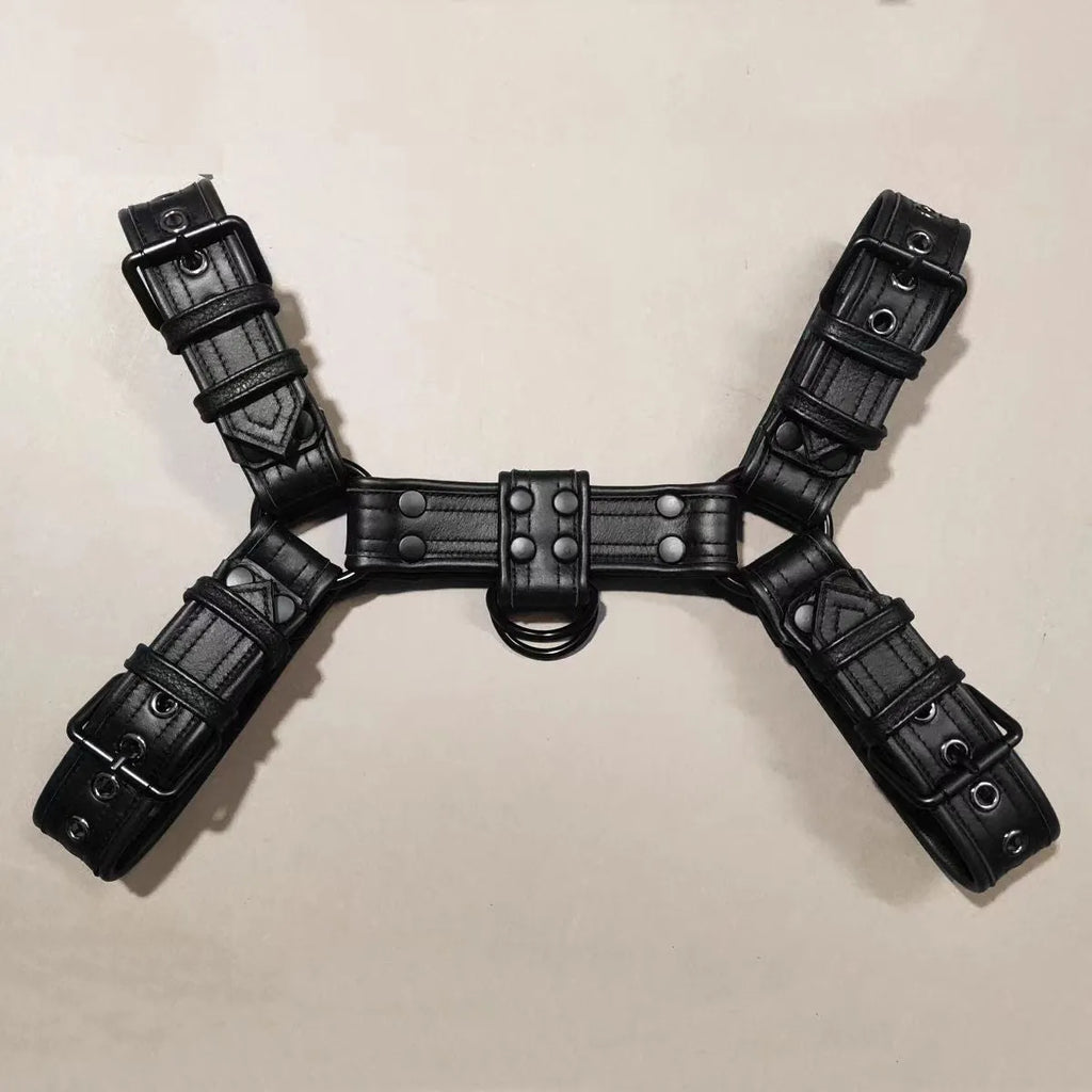 Black leather chest bondage strap with metal buckle and rivet details for cosplay and festival outfits