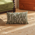 Close-up of a square jacquard pillow cover with a woven retro floral pattern in various colours, sized 45 by 45 cm.