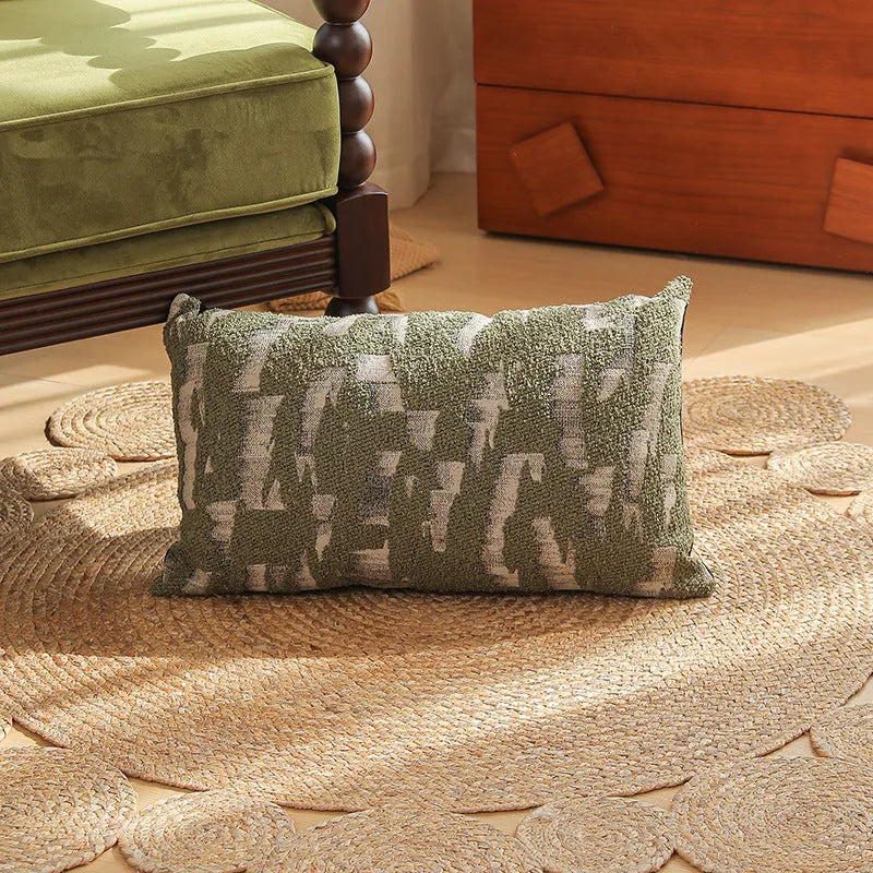 Close-up of a square jacquard pillow cover with a woven retro floral pattern in various colours, sized 45 by 45 cm.