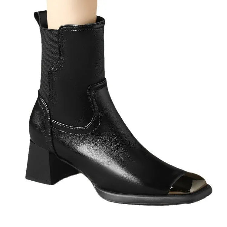 Brown women's Martin boots with high heel and side zip on a white background.