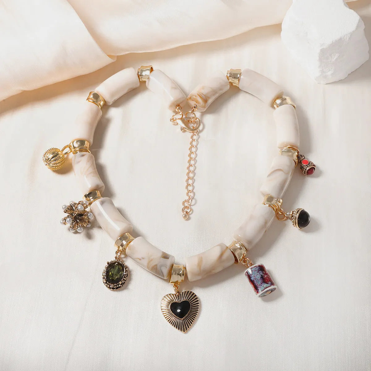 Heart-shaped resin and bamboo pendant necklace with electroplated colour finish