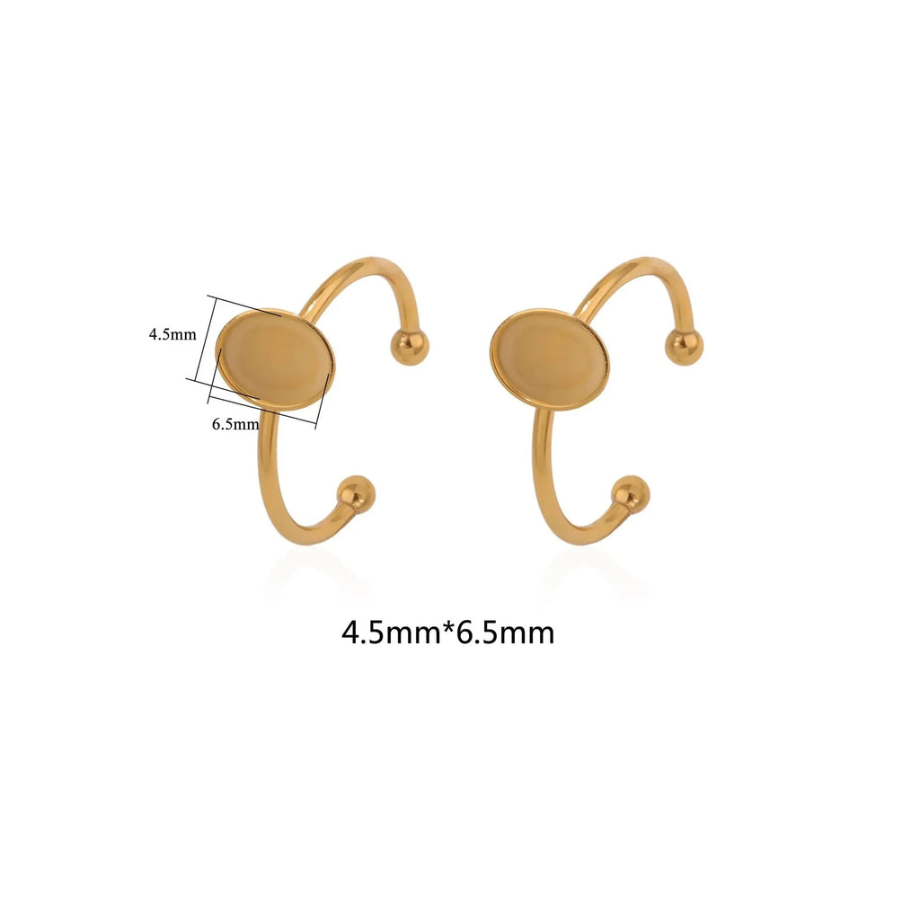 Golden stainless steel ring setting with totem pattern for DIY jewellery making, shown with a ring holder.