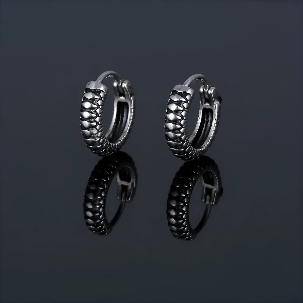 Silver titanium steel geometric twist earrings with round sports-style elements