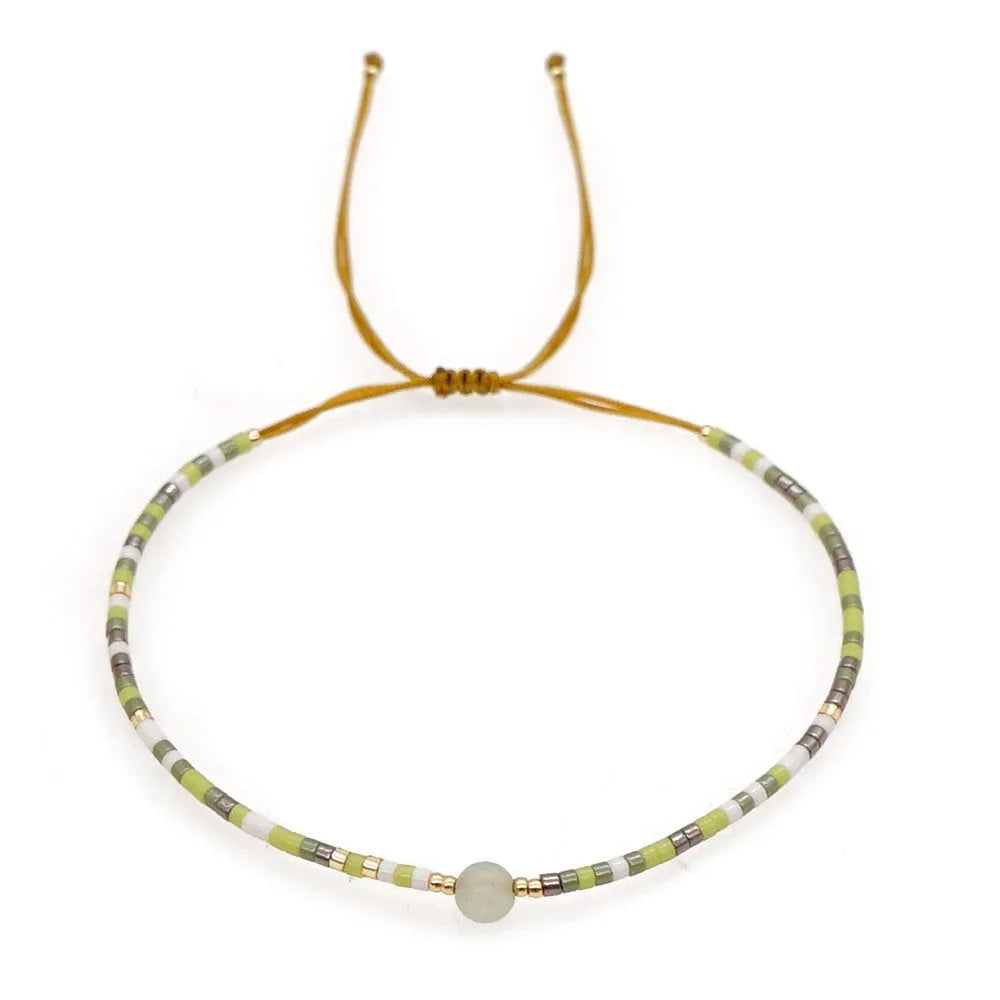 Bohemian style women's bracelet with semi-precious stone and colourful glass beads on adjustable fastening