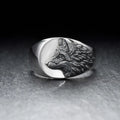 Geometric wolf head alloy signet ring in silver colour on a solid background