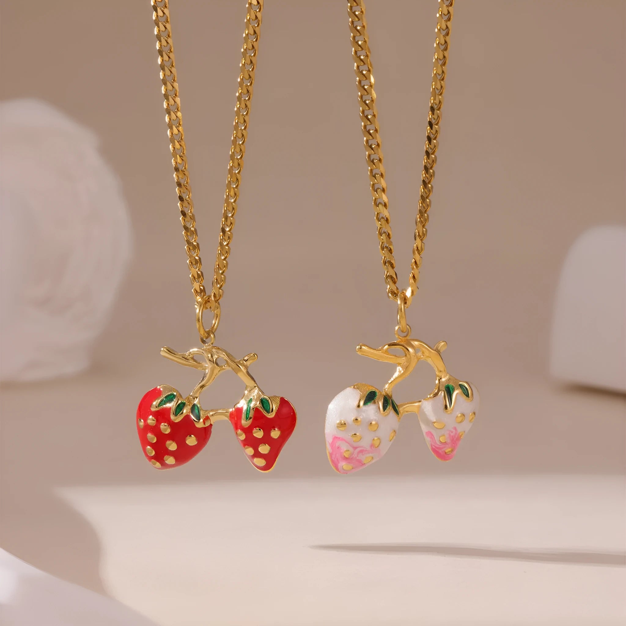 Stainless steel necklace with a detailed strawberry fruit pendant in red or white gradient finish.
