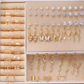 108 gold and yellow alloy geometric pearl earrings set for women displayed together.