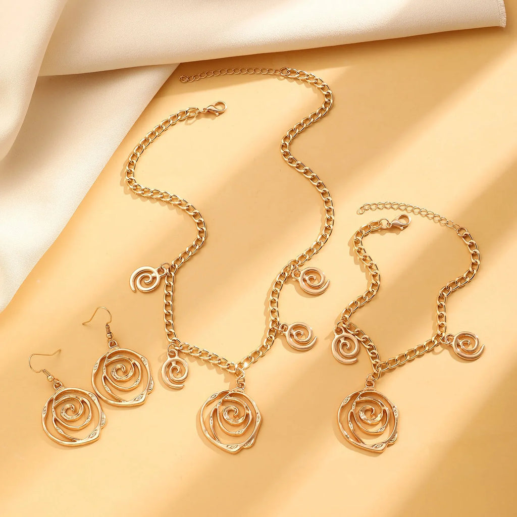 Spiral donut geometric jewellery set with necklace bracelet earrings in gold finish