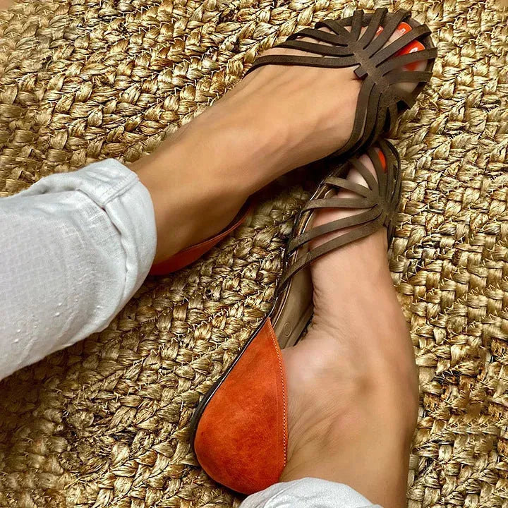 Women's leopard print flat-heel sandals with a square buckle and ankle strap.
