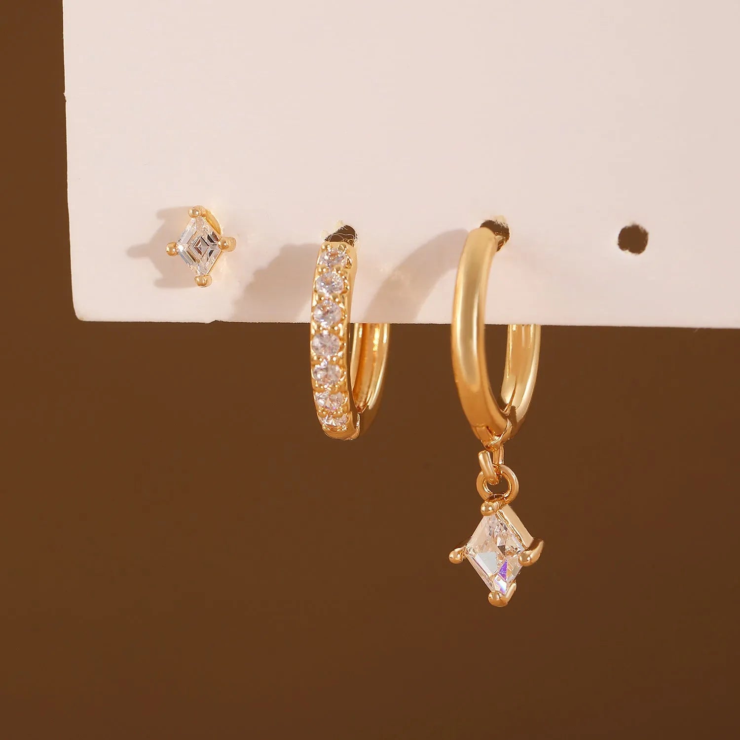 Ladies three-piece earring set with geometric designs and inlaid zircon accents