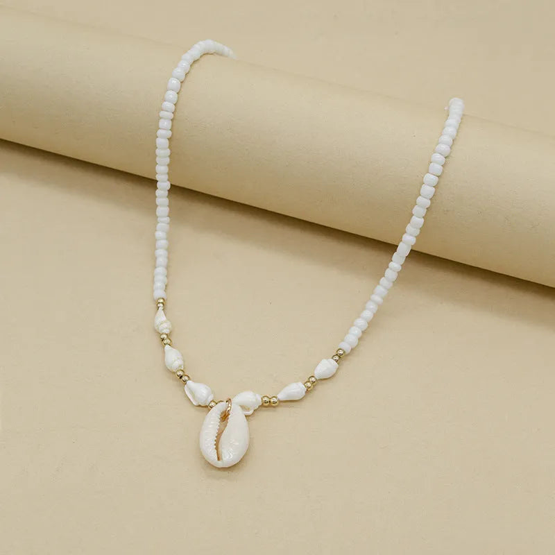 White shell necklace with mother of pearl pendant on regular chain