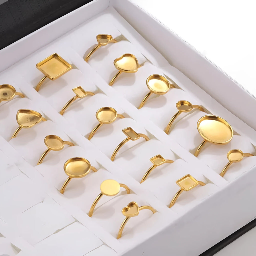 Golden stainless steel ring setting with totem pattern for DIY jewellery making, shown with a ring holder.