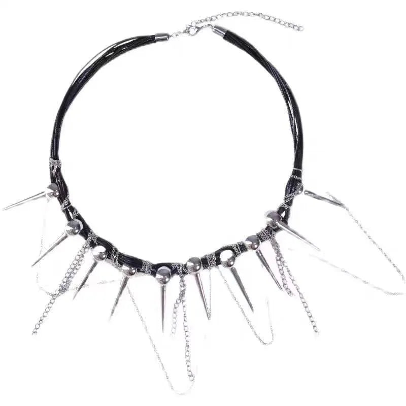 Leather necklace with winding tassel, round beads, and silver point rivet details.