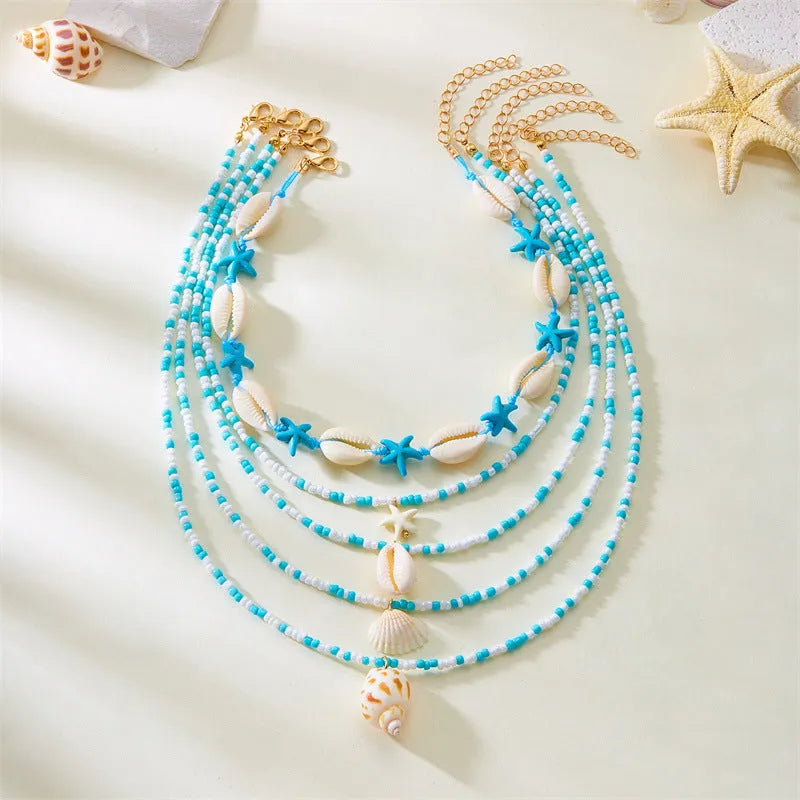 Women's five-piece shell bead necklace set with adjustable length showing blue and coloured variants