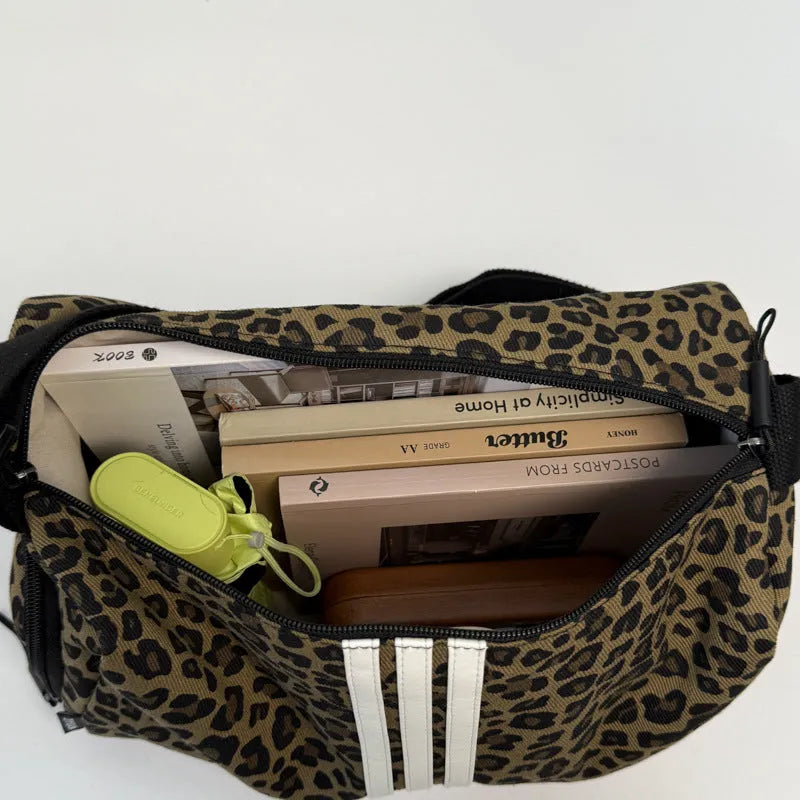 Large capacity sports style messenger bag in leopard print or striped pattern with cross-body strap