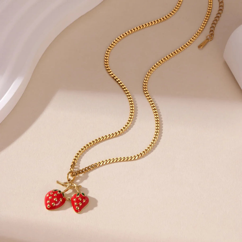 Stainless steel necklace with a detailed strawberry fruit pendant in red or white gradient finish.