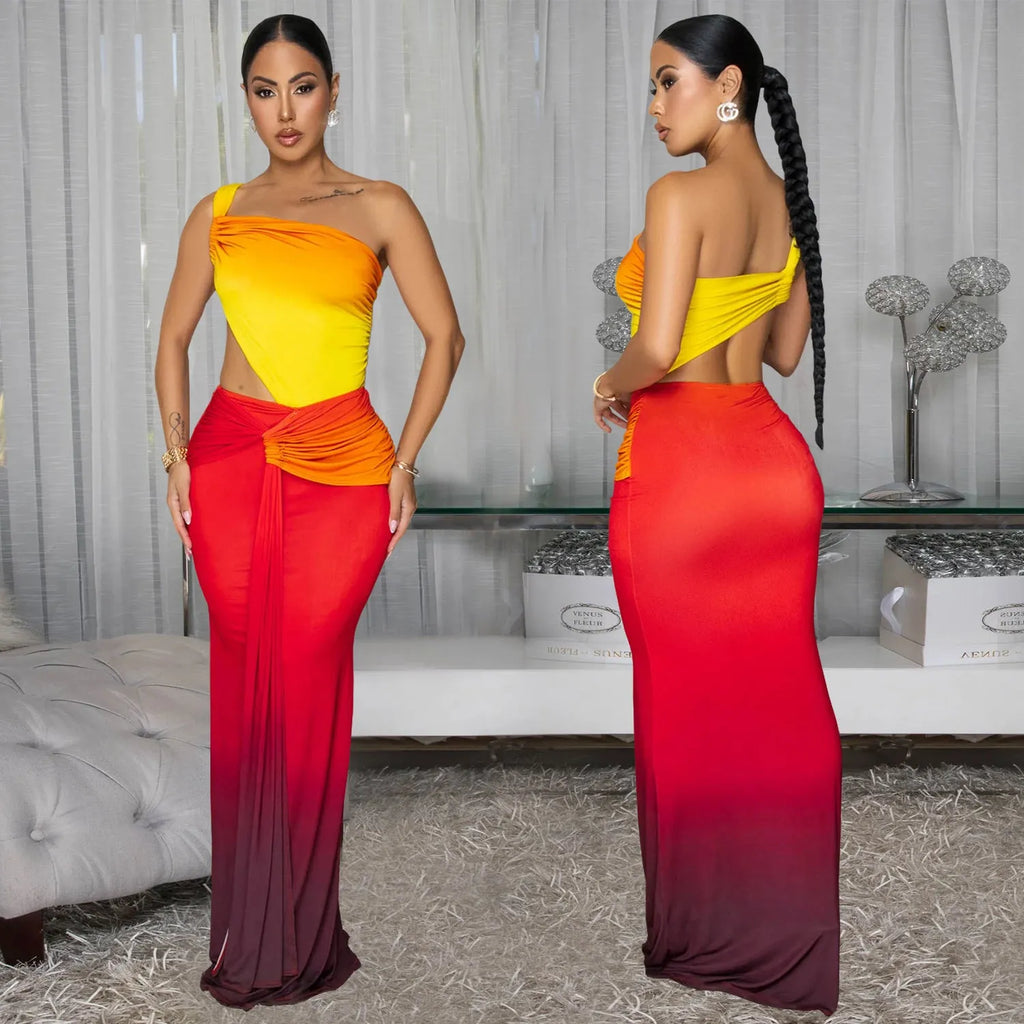 A woman's gradient colour cross-shoulder sleeveless dress with a high waist and long skirt.