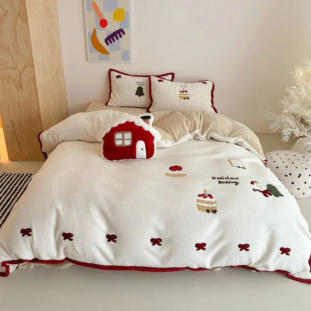Cartoon Christmas themed bedding four-piece set for children's beds showing bed sheet, pillowcases, and duvet cover
