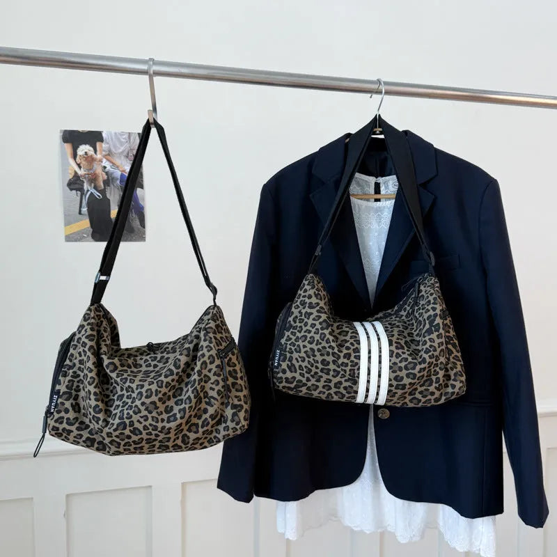 Large capacity sports style messenger bag in leopard print or striped pattern with cross-body strap