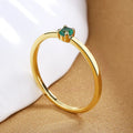 Copper fine circle ring for women with a single diamond, shown in blue, green, red, and white colour options.