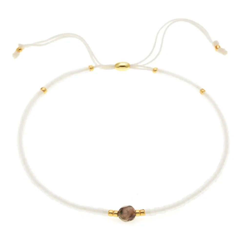 Bohemian style women's bracelet with semi-precious stone and colourful glass beads on adjustable fastening