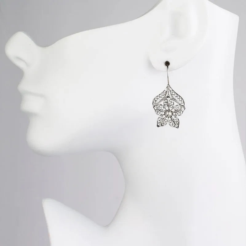 Silver alloy hollow flower and leaf-shaped earrings for women, retro simple design