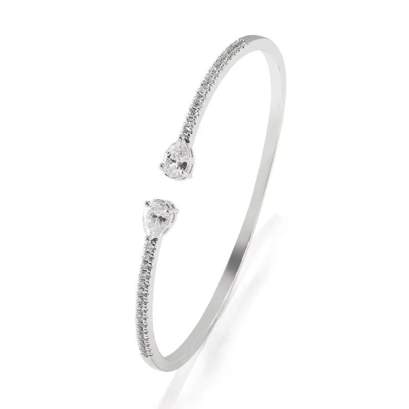 Copper bracelet with multi-zircon inlay in blue or white colour options