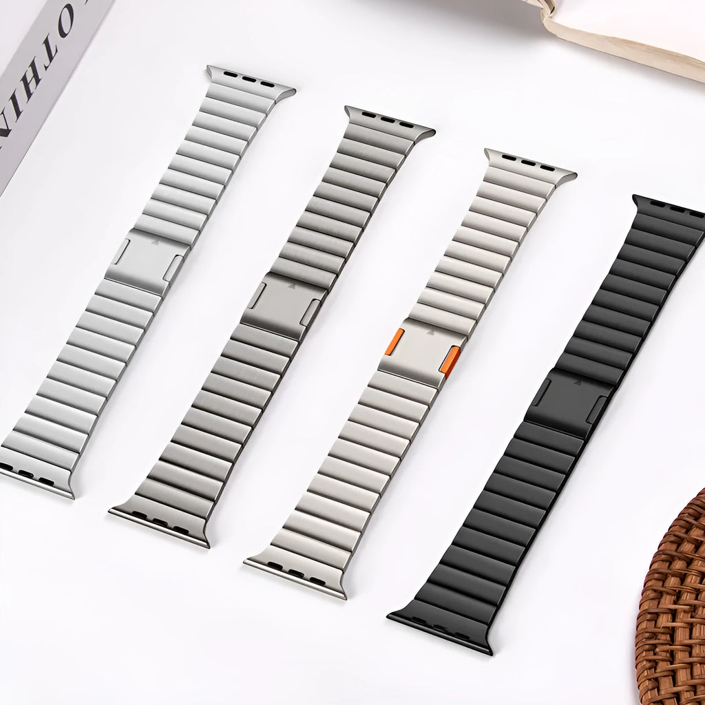 Stainless steel magnetic buckle Apple Watch strap in business style on a wrist.