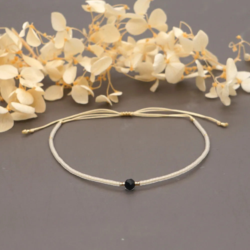 Bohemian style women's bracelet with semi-precious stone and colourful glass beads on adjustable fastening