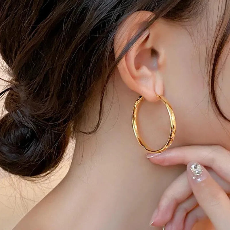 40mm circular metal earrings in gold or silver electroplated finish