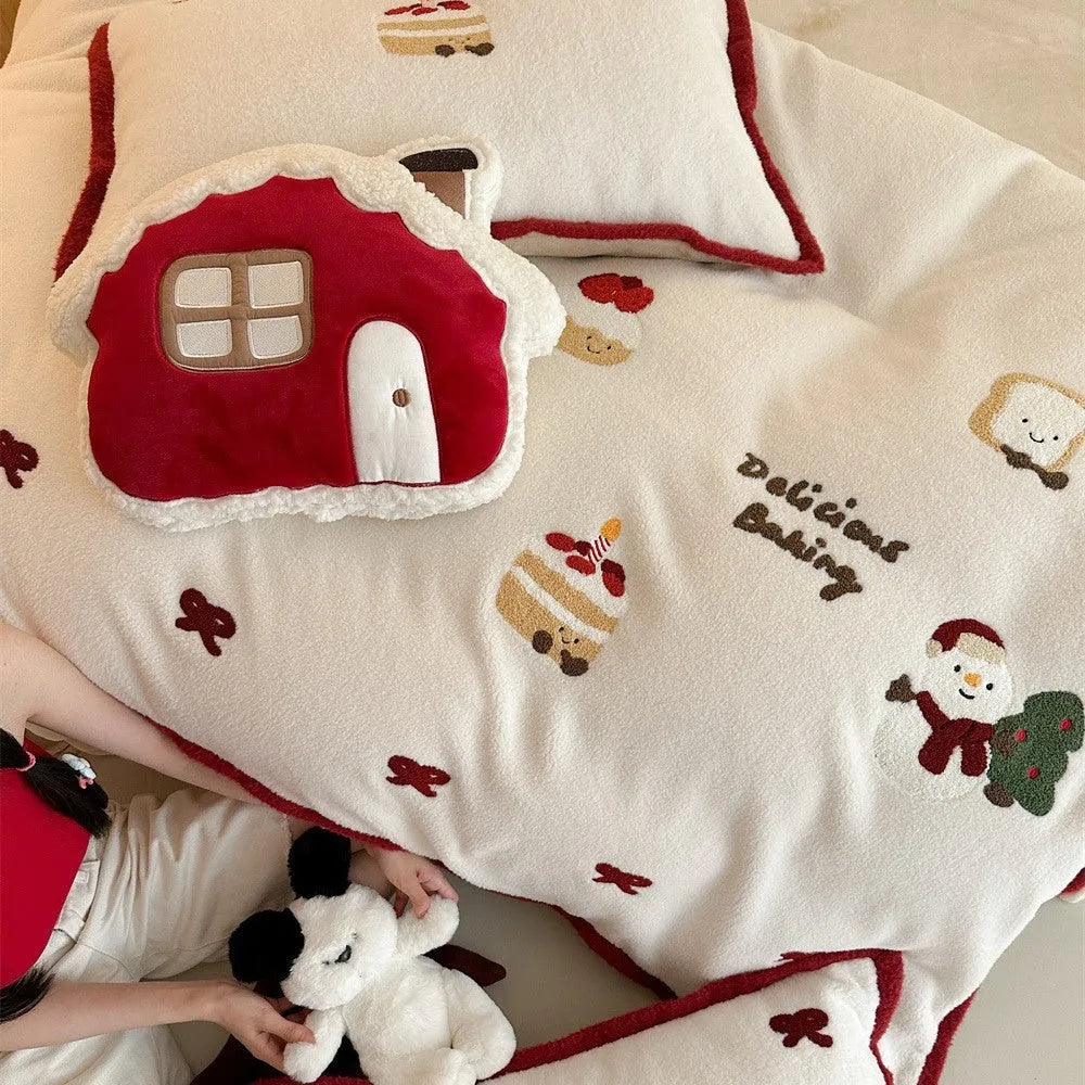Cartoon Christmas themed bedding four-piece set for children's beds showing bed sheet, pillowcases, and duvet cover