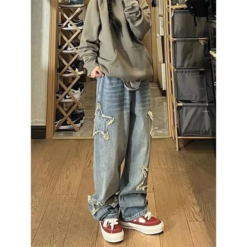 Blue straight-leg high-waist women's denim jeans on a neutral background.