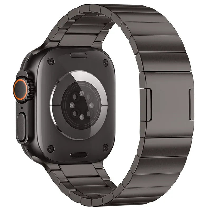 Stainless steel magnetic buckle Apple Watch strap in business style on a wrist.