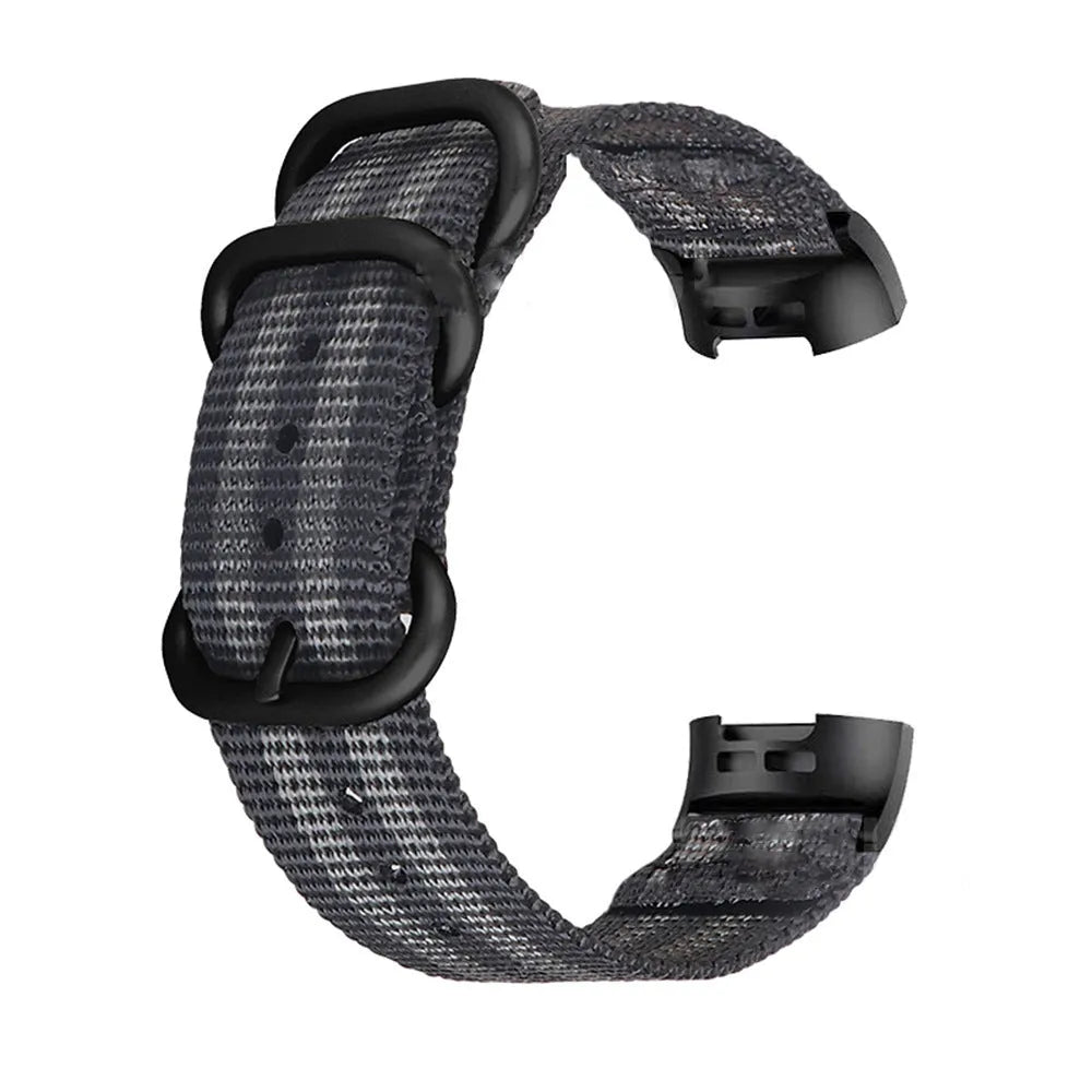 Fitbit Charge nylon replacement strap with a three-ring metal buckle shown in multiple colour options.