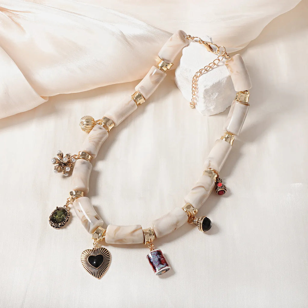 Heart-shaped resin and bamboo pendant necklace with electroplated colour finish