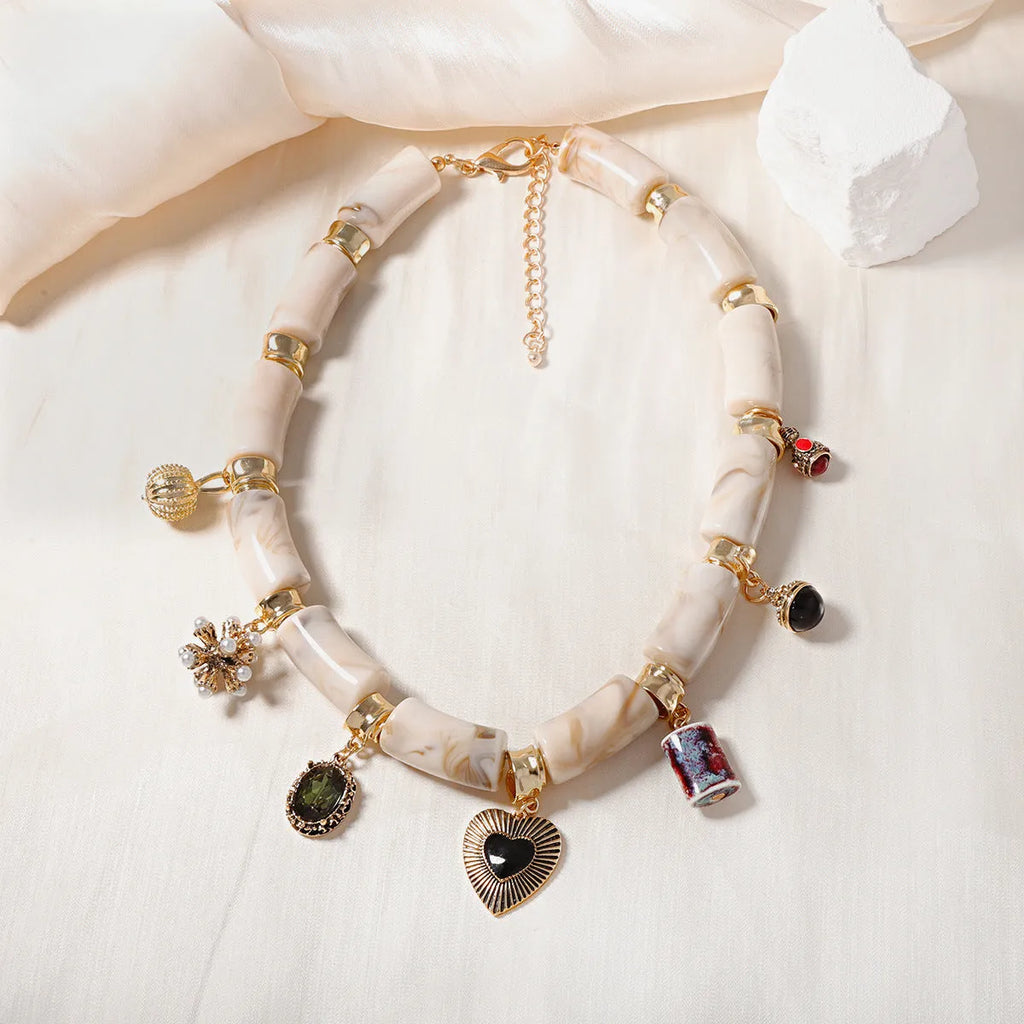 Heart-shaped resin and bamboo pendant necklace with electroplated colour finish