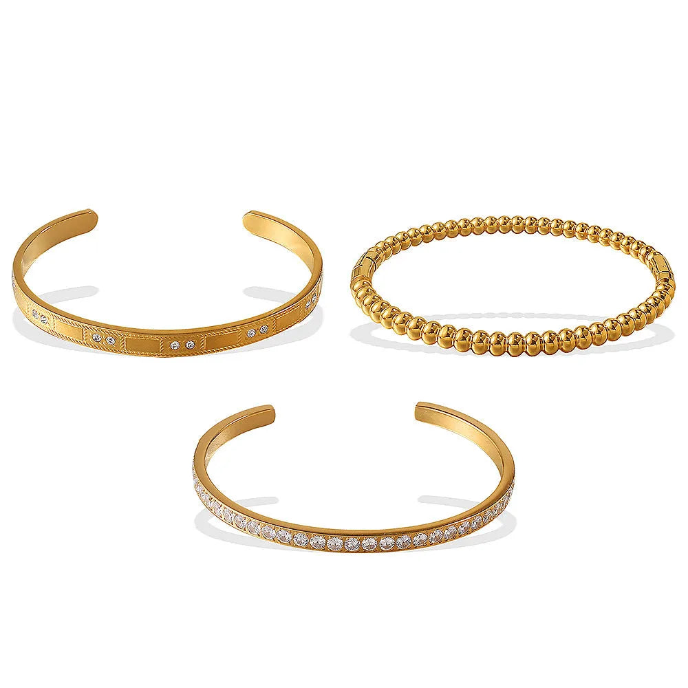 Stainless steel open-end buckle bracelet with electroplated finish, available in gold, white zirconium, and white diamond colours