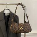 Women's casual large black PU shoulder bag with a sandwich pocket, shown next to brown and khaki colour options.
