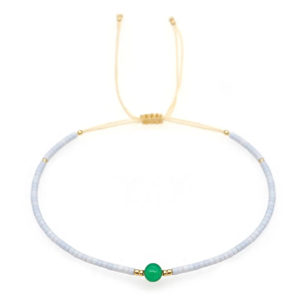 Bohemian style women's bracelet with semi-precious stone and colourful glass beads on adjustable fastening