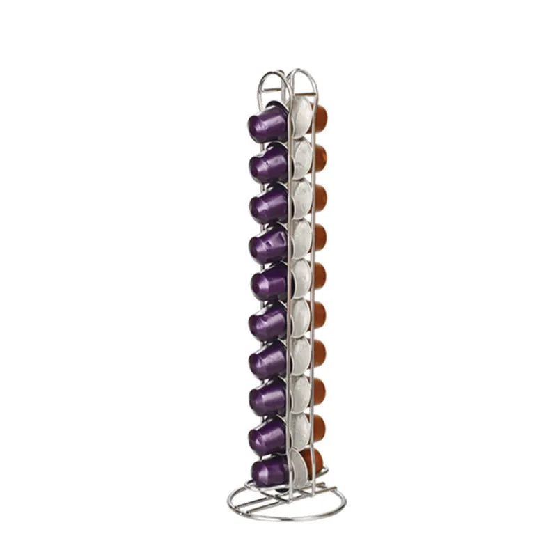 Black wrought iron coffee capsule storage rack holding pods on open shelves.