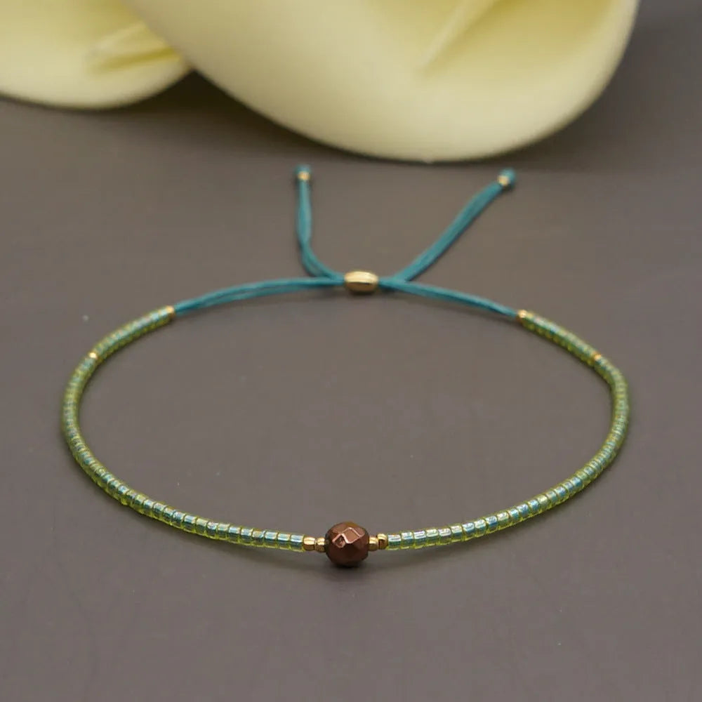 Bohemian style women's bracelet with semi-precious stone and colourful glass beads on adjustable fastening